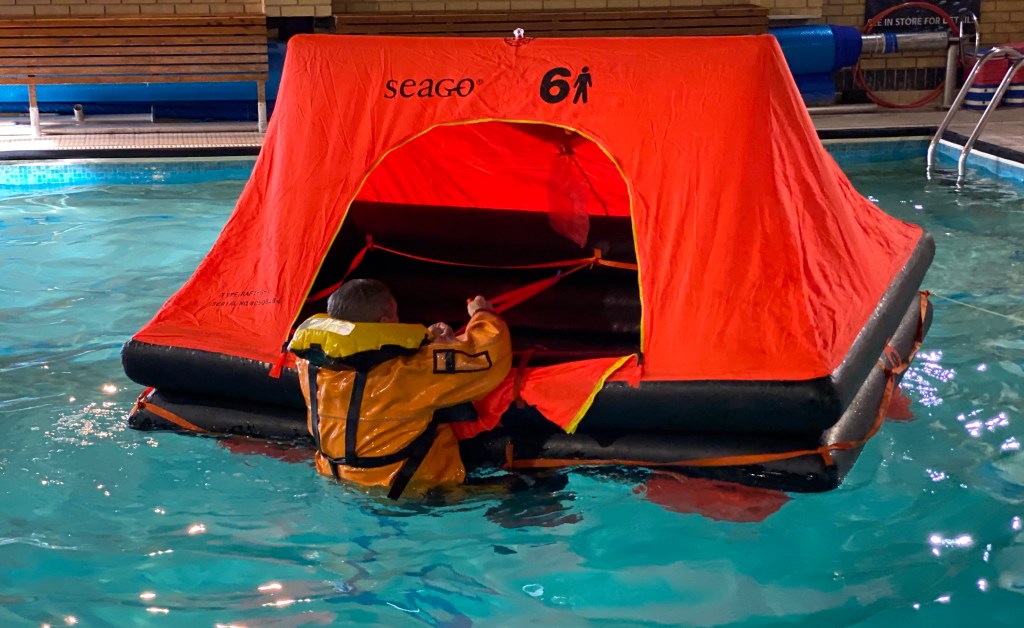 Person Climbing into a 6 Person Raft